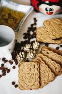 Close-up of biscuits with coffee beans, showcasing tasty treats arranged artistically.